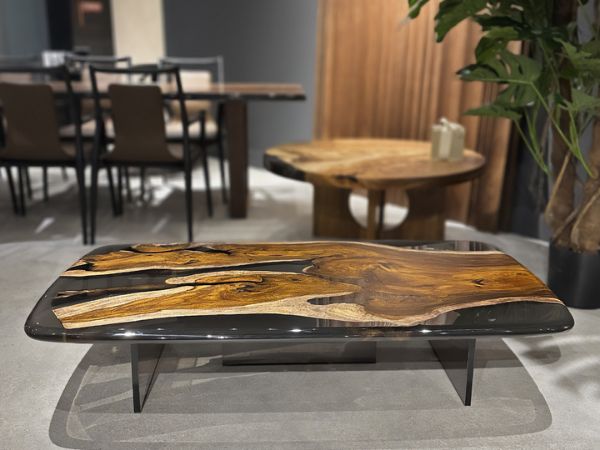 Artistic coffee table with black resin inlay, natural wood grain, contemporary living room furniture