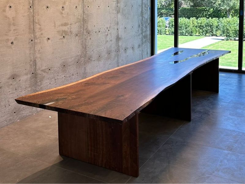 Black walnut family table with live edge in commercial space Winter Park Florida